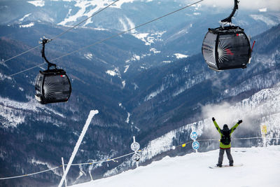 Man skiing on snow covered mountain