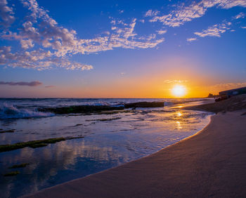 Scenic view of sea against sky during sunset