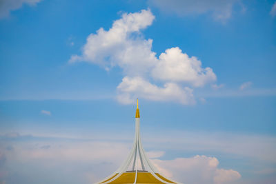 High section of built structure against blue sky