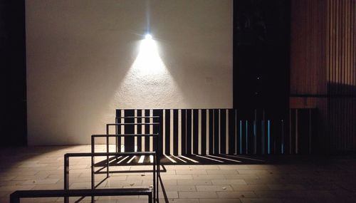 View of illuminated empty road