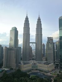 Modern buildings in city against sky