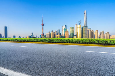 View of city buildings against clear sky