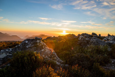 Scenic view of mountains against sky during sunset