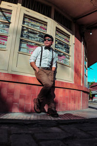 Portrait of young man standing on street