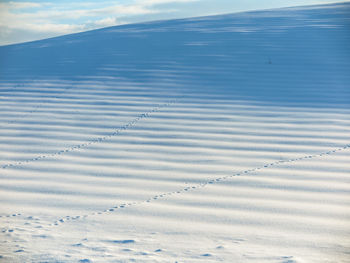 High angle view of snowy field against sky