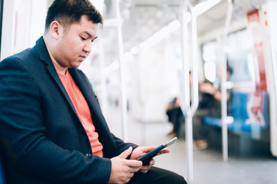 Young man using mobile phone