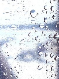 Close-up of water drops on glass window