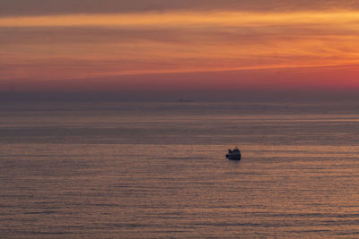 Scenic view of sea at sunset