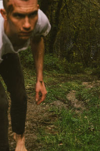 Midsection of man in forest