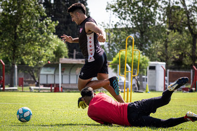 People playing with ball in park