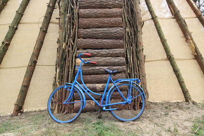 Bicycle leaning against wall