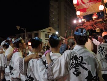 Crowd in city at night