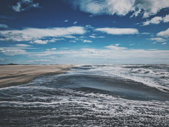 Scenic view of beach against sky