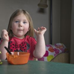 Portrait of cute girl having food