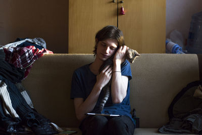 Woman sitting on sofa