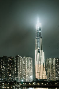 Illuminated modern buildings in city at night