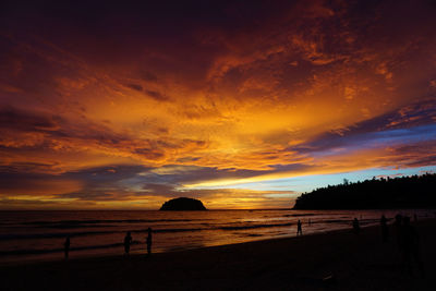 Scenic view of beach against sky during sunset