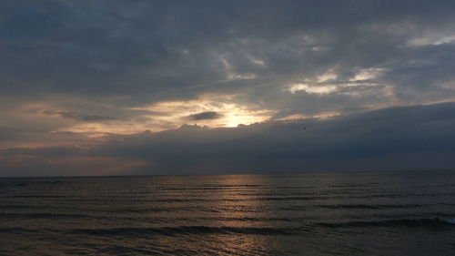 Scenic view of sea against cloudy sky