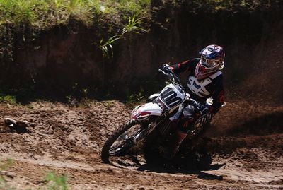 Man riding motorcycle on field