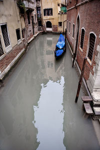 High angle view of gondola moored in canal