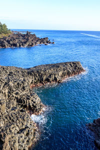 Scenic view of sea against clear blue sky