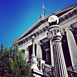 Low angle view of built structure against clear blue sky