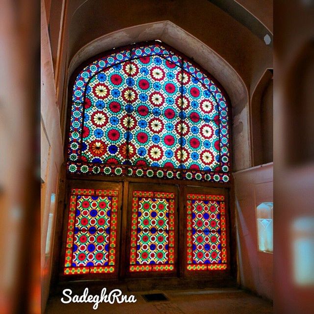 indoors, multi colored, window, architecture, religion, blue, built structure, church, arch, place of worship, door, spirituality, entrance, day, no people, house, building exterior, design, closed