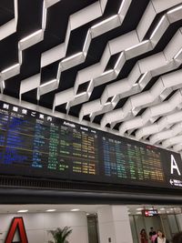 Low angle view of illuminated lighting equipment at airport