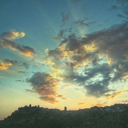 Scenic view of landscape against sky at sunset