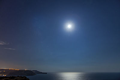 Scenic view of sea against sky at night