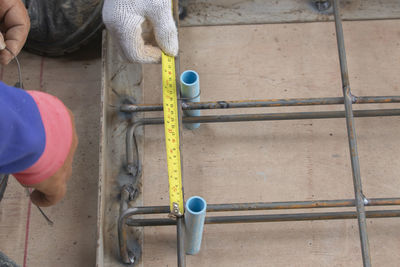 Low section of man working at construction site