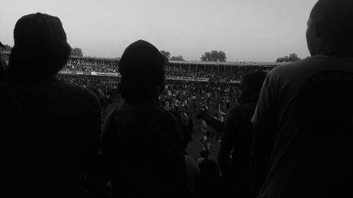 Rear view of people looking at view