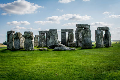 View of ruins of landscape against cloudy sky