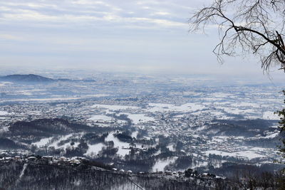 Aerial view of city against sky