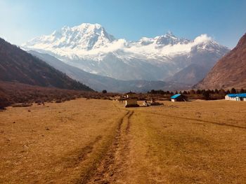 Scenic view of snowcapped mountains against sky