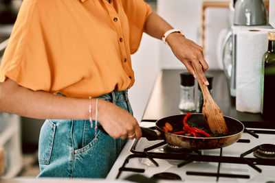 Midsection of man preparing food