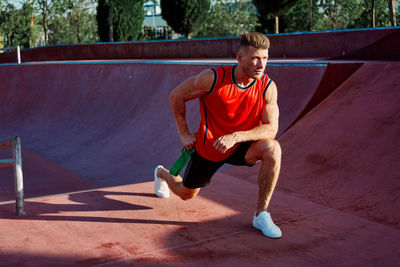 Side view of woman sitting on slide