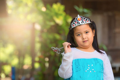 Close-up portrait of cute girl standing outdoors