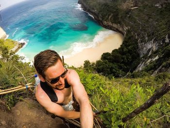 High angle view of young man on rocks