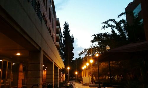 Street lights in city at dusk