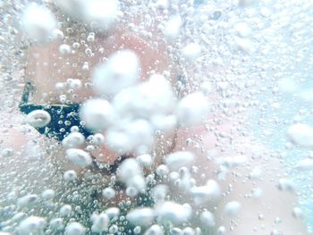 Full frame shot of wet glass window during rainy season