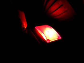 Close-up of illuminated light bulbs in darkroom