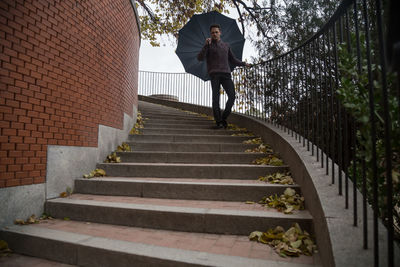 Low angle view of woman on staircase