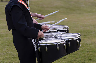 Snare drums of a marching band drum line warming up for a parade