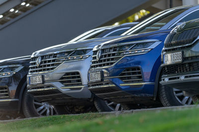 Tilt image of car on field against blue sky