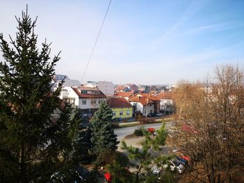 High angle view of trees and buildings against sky