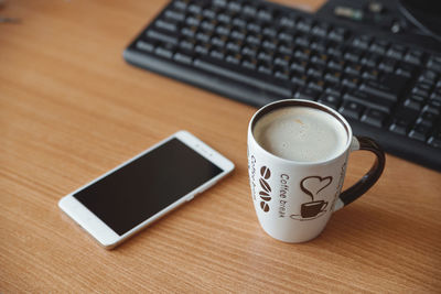 High angle view of coffee cup on table