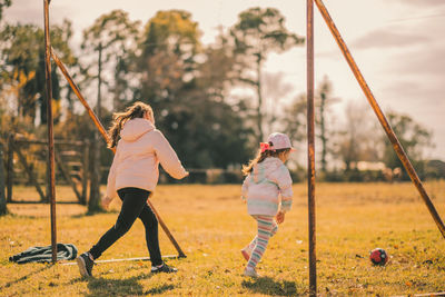 Portrait of little girls playing soccer