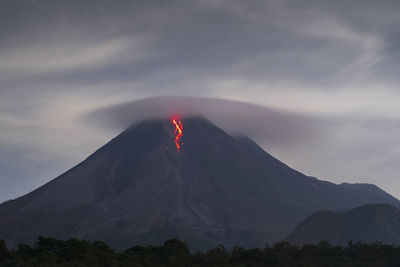 Scenic view of volcanic mountain against sky