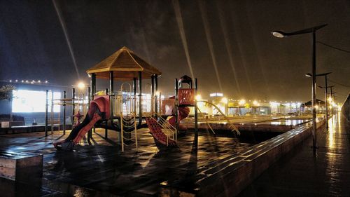 Panoramic view of illuminated city against sky at night